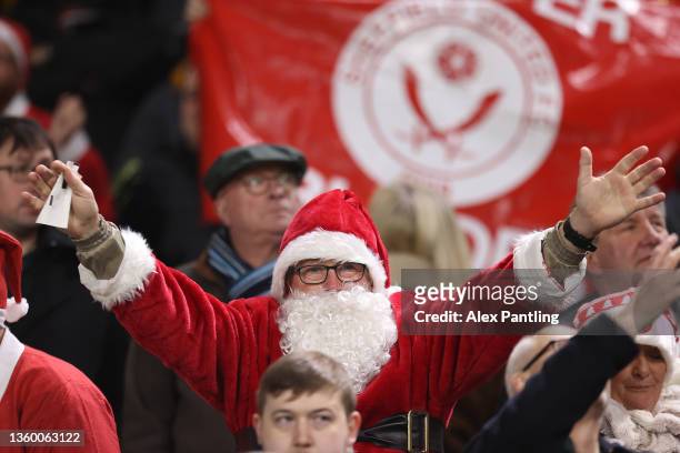 Fan is seen dressed as Santa before the Sky Bet Championship match between Fulham and Sheffield United at Craven Cottage on December 20, 2021 in...