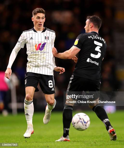 Harry Wilson of Fulham FC and Enda Stevens of Sheffield United in action during the Sky Bet Championship match between Fulham and Sheffield United at...