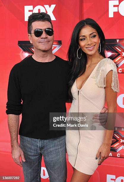Simon Cowell Nicole Scherzinger Photos And Premium High Res Pictures Simon Cowell Nicole Scherzinger Photos And Premium High Res Pictures