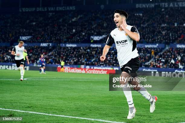 Carlos Soler of Valencia CF celebrates after scoring his team's third goal during the LaLiga Santander match between Levante UD and Valencia CF at...