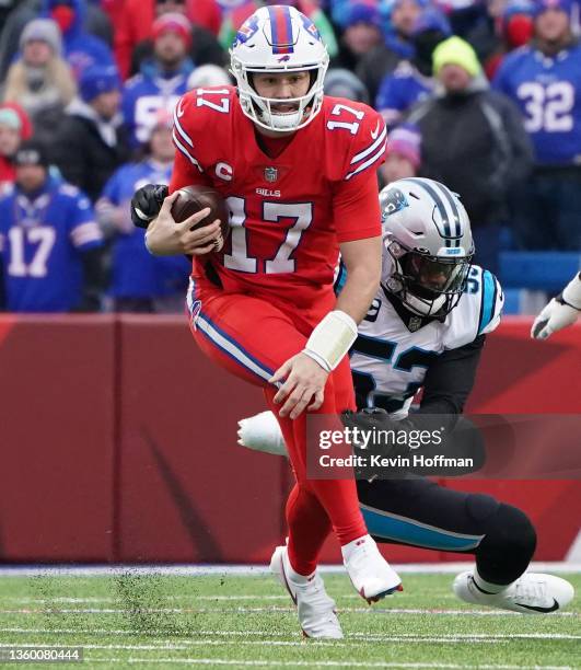 Josh Allen of the Buffalo Bills and Brian Burns of the Carolina Panthers during the game at Highmark Stadium on December 19, 2021 in Orchard Park,...