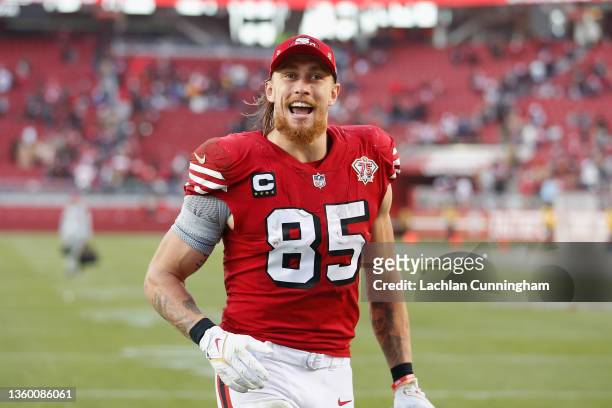George Kittle of the San Francisco 49ers celebrates with fansafter a win against the Atlanta Falcons at Levi's Stadium on December 19, 2021 in Santa...