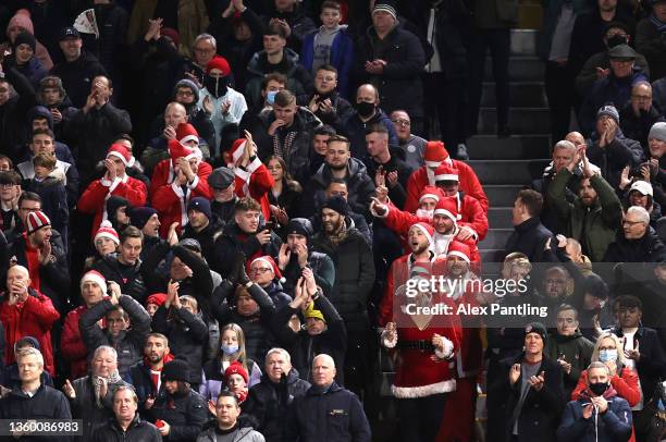 Sheffield United supporters dressed as Santa Claus during the Sky Bet Championship match between Fulham and Sheffield United at Craven Cottage on...