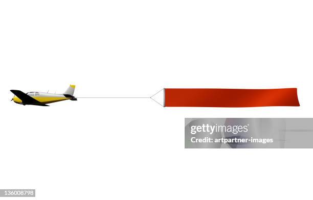 airplane with banner for advertising - bord bericht stockfoto's en -beelden