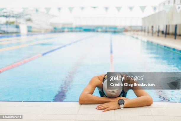 sad emotions of upset woman after losing in swimming competition. failure in professional sports - professional sportsperson ストックフォトと画像