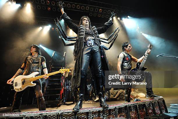Chuck Garric, Alice Cooper and Tommy Henriksen of the Alice Cooper band perform at Hard Rock Live! in the Seminole Hard Rock Hotel & Casino on...