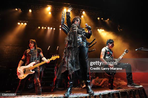 Chuck Garric, Alice Cooper and Tommy Henriksen of the Alice Cooper band perform at Hard Rock Live! in the Seminole Hard Rock Hotel & Casino on...
