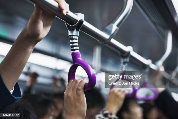 a crowded subway carriage. - train interior stock pictures, royalty-free photos & images