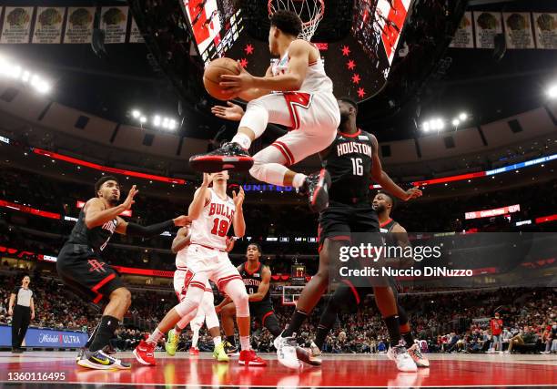 Devon Dotson of the Chicago Bulls looks to pass against the Houston Rockets during the second half at the United Center on December 20, 2021 in...