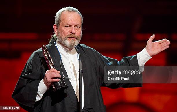 British director Terry Gilliam holds his 'European Film Academy Short Film 2011' award during the 24th European Film Awards ceremony at Tempodrom on...