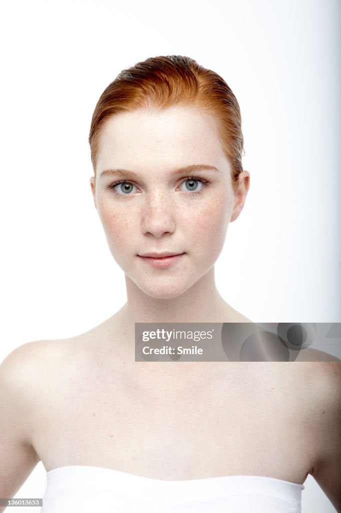 Portrait of redhead girl with hair gelled back