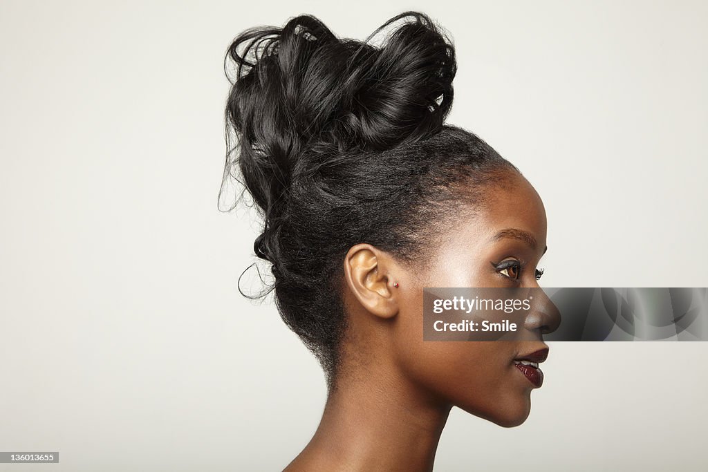 Young Woman With Hair Tied Up Side View High-Res Stock Photo - Getty Images