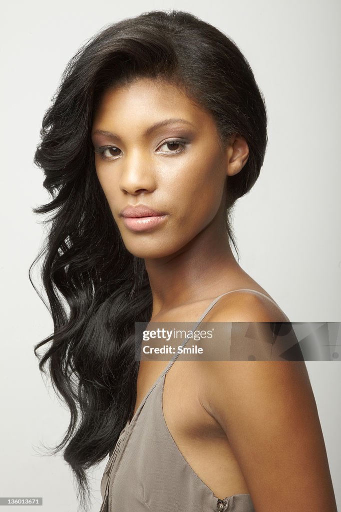 Young woman with hair pulled over her shoulder