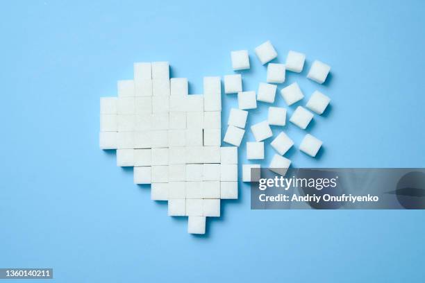 sugar cubes in heart shape - sugar ストックフォトと画像