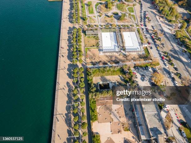 nea paralia area with small tennis stadium, thessaloniki, greece - thessaloniki stock pictures, royalty-free photos & images