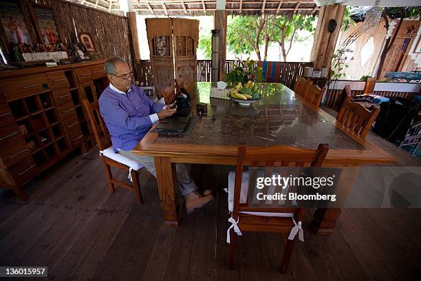 Jose Ramos-Horta, East Timor's president, uses a mobile phone at his home near Dili, East Timor, on Sunday, Oct. 23, 2011. East Timor, which became a...