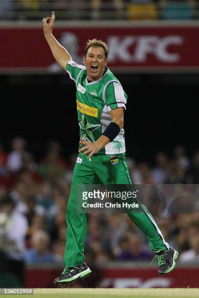 Shane Warne of the Stars celebrates with team mates after taking a wicket during the T20 Big Bash League match between the Brisbane Heat and the...
