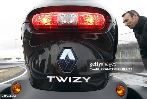 The back of a new Renault electric car Twizy Z.E is pictured on December 20, 2011 at the Ile Séguin test centre for electric vehicles in...