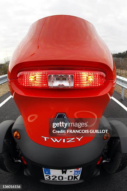 The back of a new Renault electric car Twizy Z.E is pictured on December 20, 2011 at the Ile Séguin test centre for electric vehicles in...