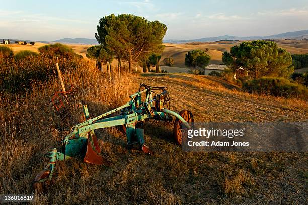 farm plow at sunset, tuscany - ancient plow stock pictures, royalty-free photos & images