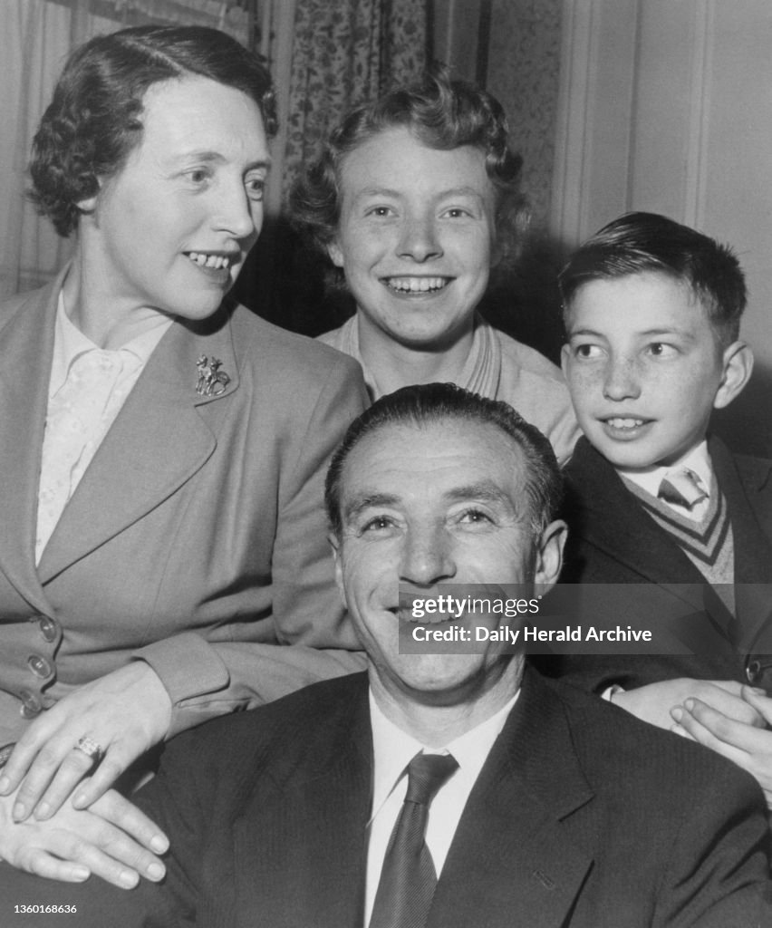 Stanley Matthews arrives in London with his family before receiving his CBE at Buckingham Palace, 1957