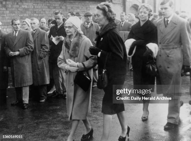 Stanley Matthews' mother Ada Matthews arriving to watch her son on his return to Stoke City escorted by his wife, Betty.