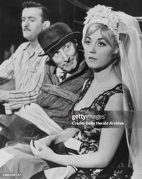 Scene from The Bed-Sitting Room by John Antrobus shown here are Mate Captain Martin the groom and Penelope , 1963.