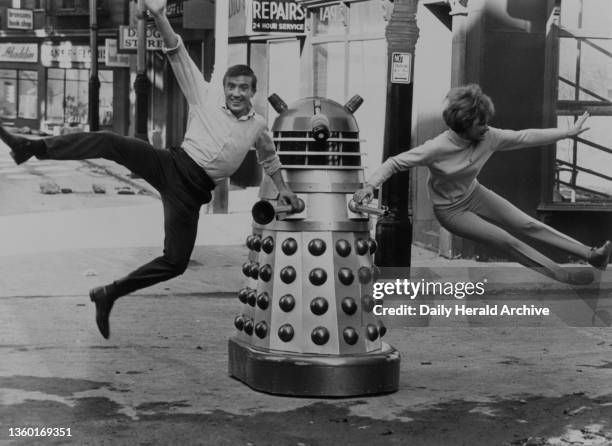 Roy Castle and Jennie Linden with a Dalek on the set of Dr Who at Shepperton Studios, London, 1965.