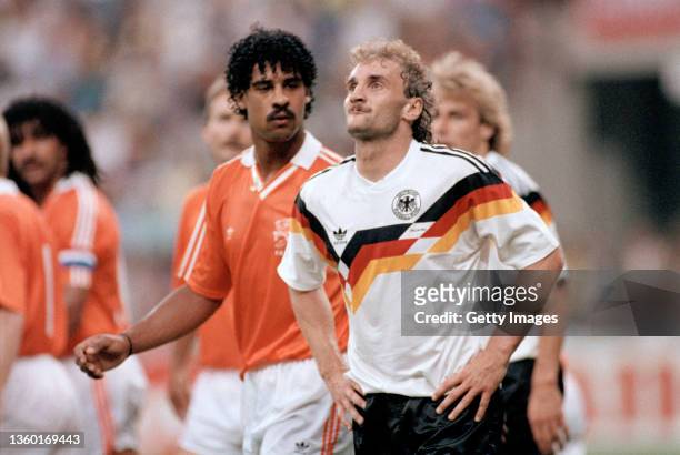 Frank Rijkaard of the Netherlands looks towards West Germany striker Rudi Voeller during the infamous spitting incident after both players were sent...