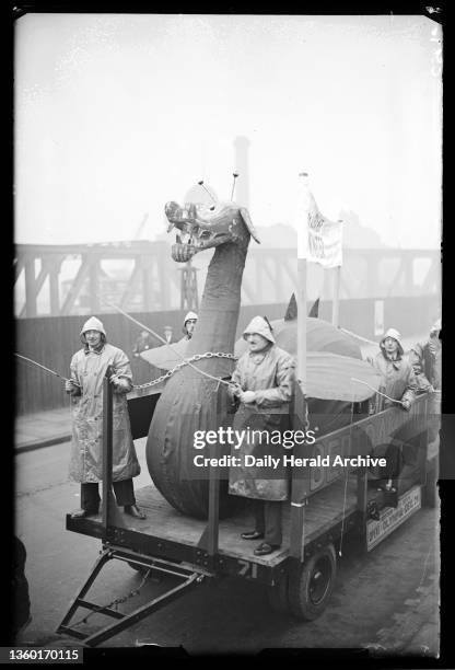 Model of the Loch Ness Monster, 1933. A photograph of a Loch Ness Monster model being taken by trailer to Bertram Mills Circus, taken by James Jarche...