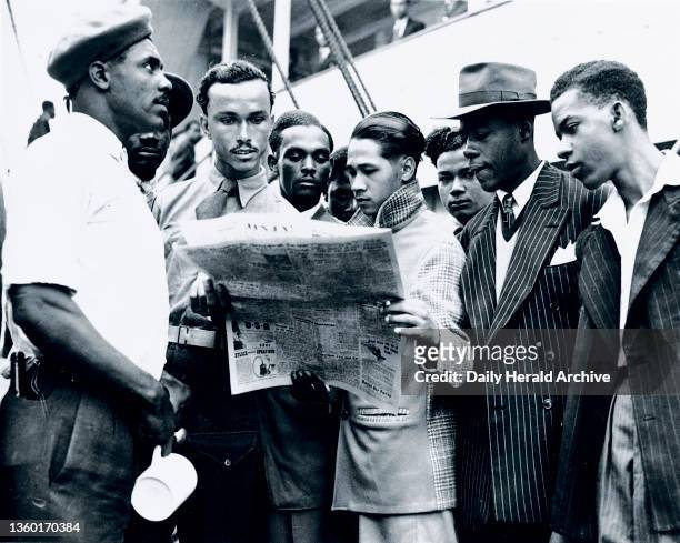 Jamaican immigrants arriving at Tilbury Docks, Essex, 22 June 1948. ‘The former troop ship 'Empire Windrush' arrived at Tilbury Docks this morning...