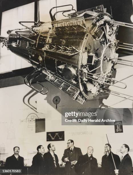 British physicists view model of Sputnik III. 15th November 1958. British physicists who are here at the invitation of the USSR Academy of Sciences...
