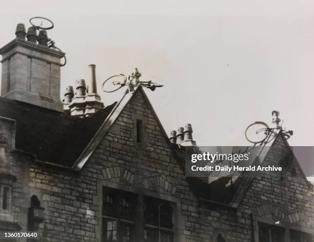 First a Car at Cambridge - Now Bikes at Oxford, 1958. 24 hours after the discovery of a van on the rooftop of the Senate House, Cambridge, five...