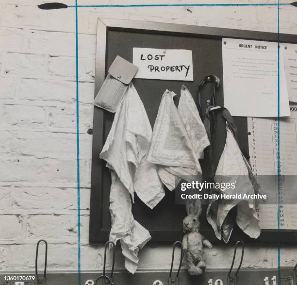 Lady Eden's School for Children, Kensington. 24th November 1957. A familiar sight at any junior school- the lost property board. Only on this one, in...