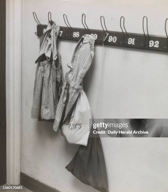 Lady Eden's School for Children, Kensington. 24th November 1957. A familiar sight at any junior school- the lost property board. Only on this one, in...