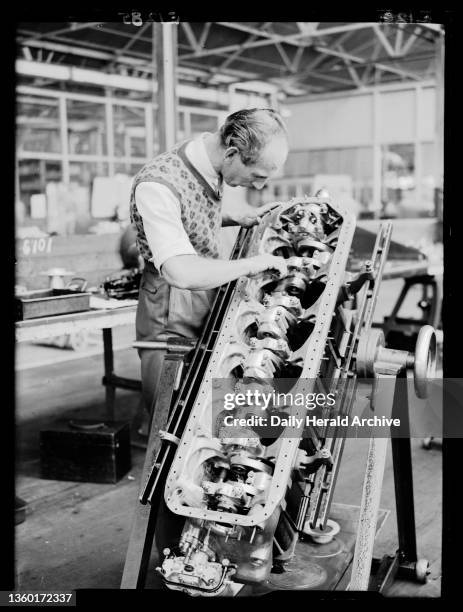 Worker in an aircraft factory, 1934. A photograph of a man working in the de Havilland Aircraft Company factory at Hatfield, Hertfordshire, taken by...