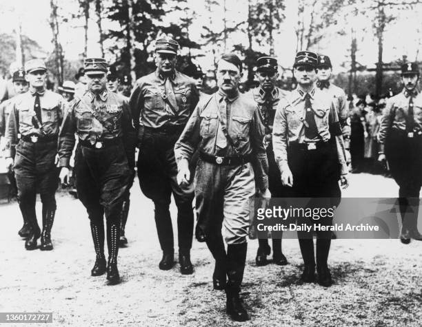 Photograph of Adolf Hitler with his bodyguards, Bad Harzburg, 1931. A photograph of Adolf Hitler with his bodyguards at mass meeting of the Nazi...
