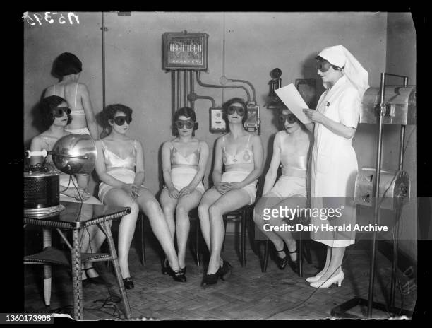 Sunray 'treatment', 1932. A photograph of women receiving sunray 'treatment', taken by Cardew for the Daily Herald newspaper on 20 February, 1932....