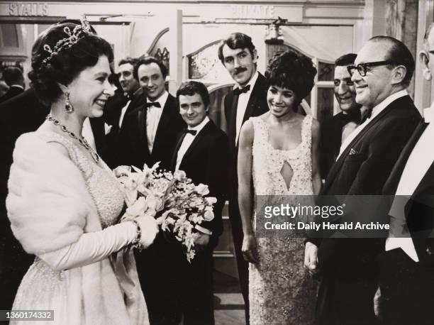 The Queen meets the artists at the Royal Variety Performance, 1965. A photograph of the Queen speaking to the line-up of artists appearing at the...