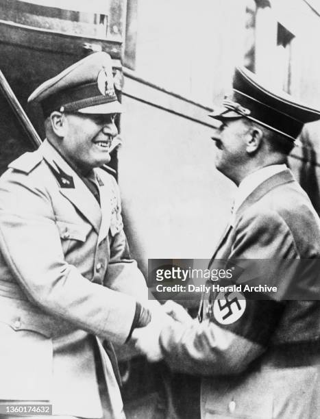 Adolf Hitler warmly greets Benito Mussolini on the latter's arrival at Kufstein on the way to Munich, 29 September 1938.
