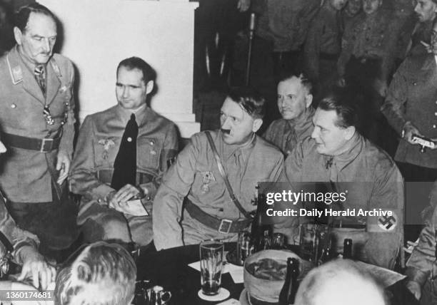 Adolf Hitler, circa 1937. Adolf Hitler with Hermann Goering , Rudolf Hess and other senior Nazi officials in a Munich beer house.