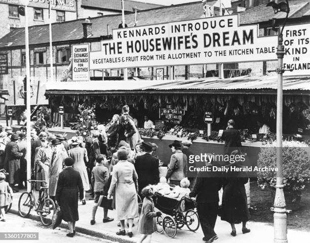 The Housewife's Dream' market, Croydon, World War Two, 9 August 1941. 'Crowds of women shoppers at the new barter market. The age-old system of...