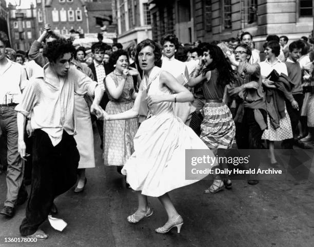 Dancing rock 'n' roll in the street, circa 1950s.