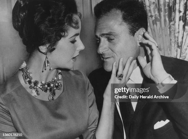 Elizabeth Taylor and Mike Todd as he announces he will buy the Palace Theatre London in order to show his £2.5 million epic film Around The World In...