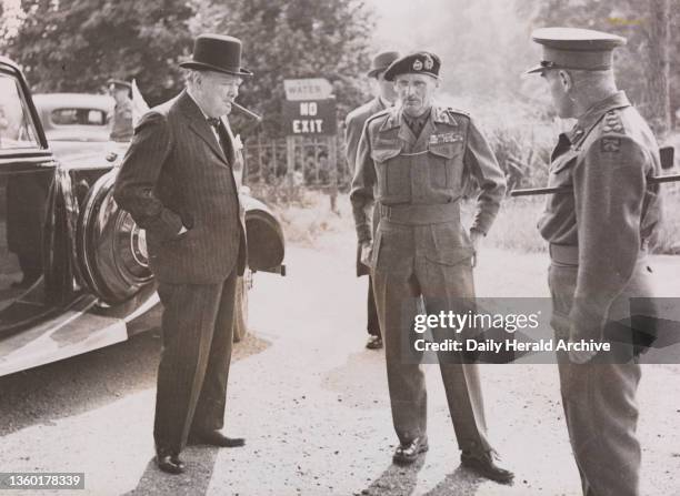 Prime Minister Winston Churchill talks with Field Marshal Montgomery,1944. During May 1944, Mr Winston Churchill visited troops, who were to take...