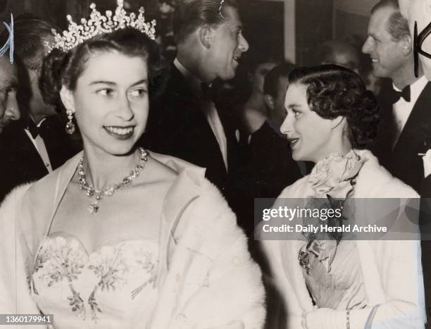 Queen Elizabeth at the opening of the Italian Film Festival, 1954. Gelatin silver print. A photograph of Queen Elizabeth II, with her sister Princess...