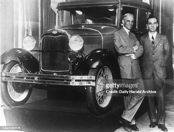 Henry Ford, American car manufacturer, with his son Edsel, circa 1920. Henry Ford founded the Ford Motor Company in 1903. He pioneered modern...
