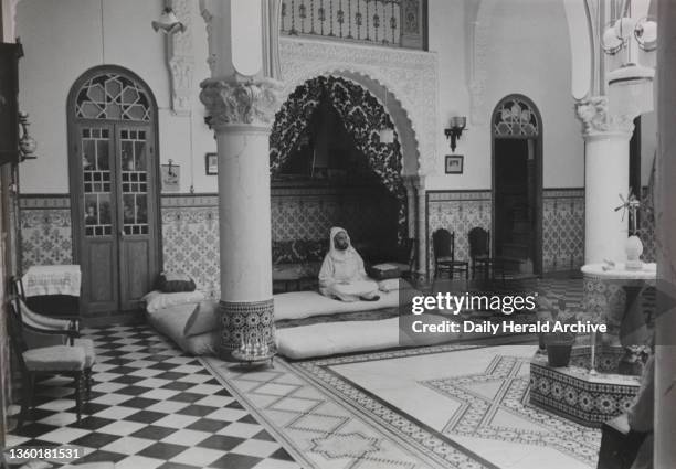 Moroccan Sultan, 1940. In his harem he has four wives. But he would not allow them to be seen. It is surprising that he gave permission for...