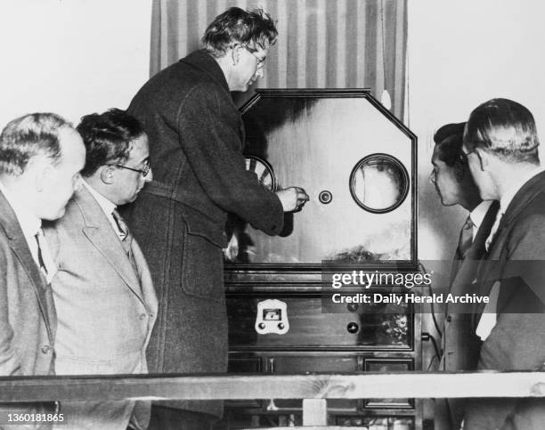 John Logie Baird the television pioneer with his model C30 line televisor, 1934. After a serious illness in 1922, Baird devoted himself to...