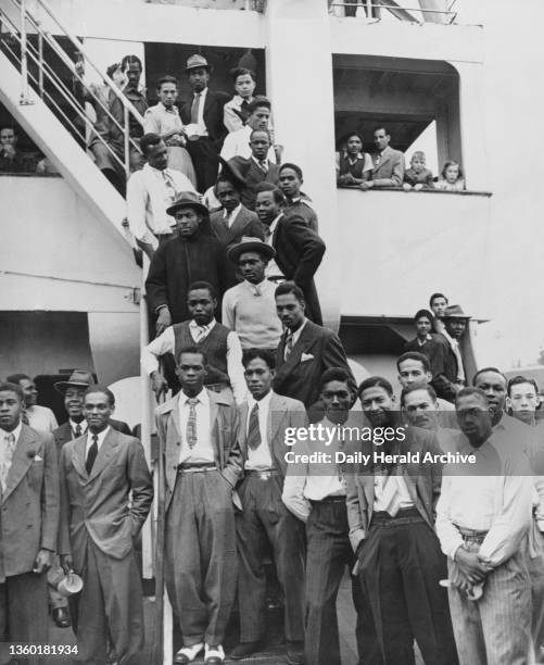 Jamaican immigrants arriving at Tilbury Docks in Essex, 22nd June 1948. The former troop ship, Empire Windrush, arrived at Tilbury Docks this morning...